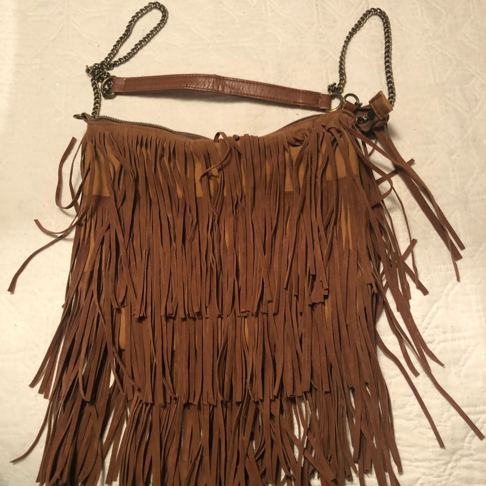 Good used condition frayed handbag. Chain strap.